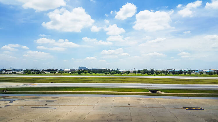 Runway with sky and fields