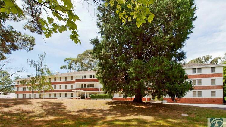 The exterior of a motel that once was an asylum.