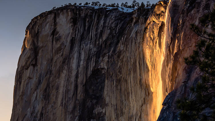 The Firefall is a fiery glow down the face of El Capitan, looking like the waterfall is on fire.
