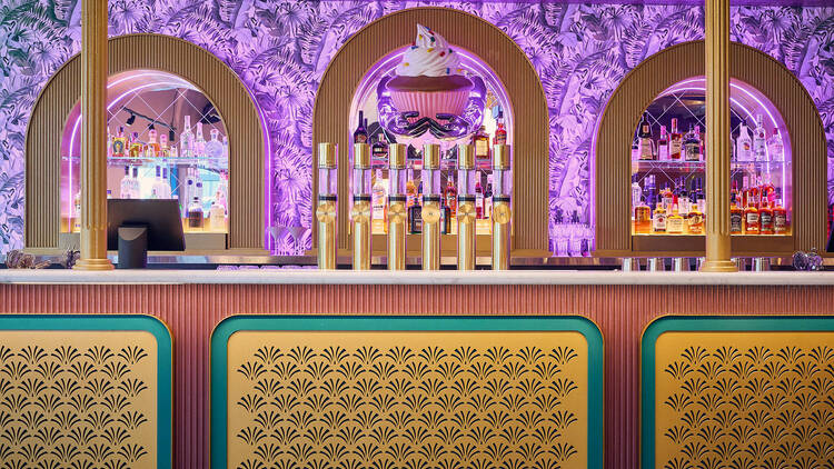 The purple and gold bar at Hijinx Hotel