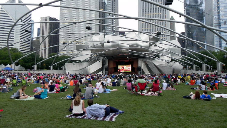 People watching a concert in Jay Pritzker Pavilion.