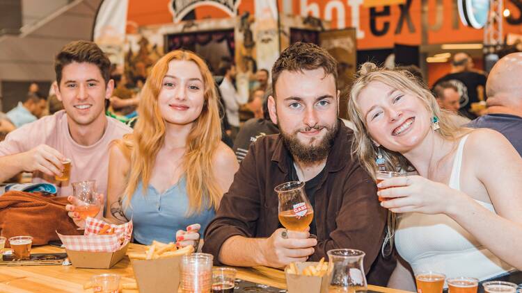 Friends enjoying beers and food at GABS festival 