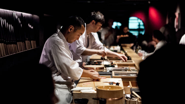 Chefs preparing some food at Kisumé