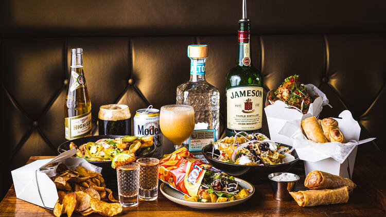 A variety of dishes and drinks on a table.