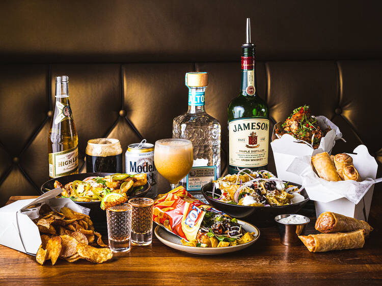 A variety of dishes and drinks on a table.