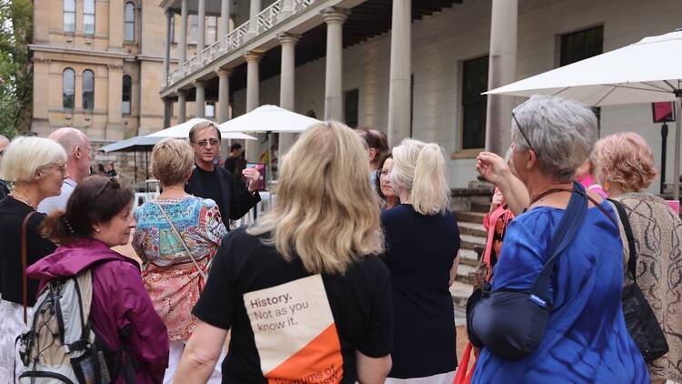 A group of people on a tour of the Mint