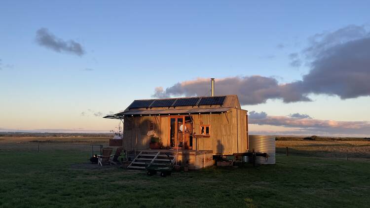 A sunset shot of off-grid accommodation Stella the Stargazer.