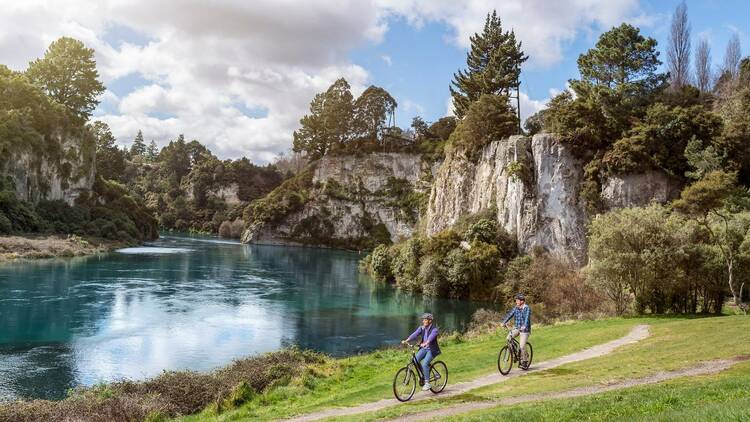 Cyclists along the Huka Falls Trail New Zealand