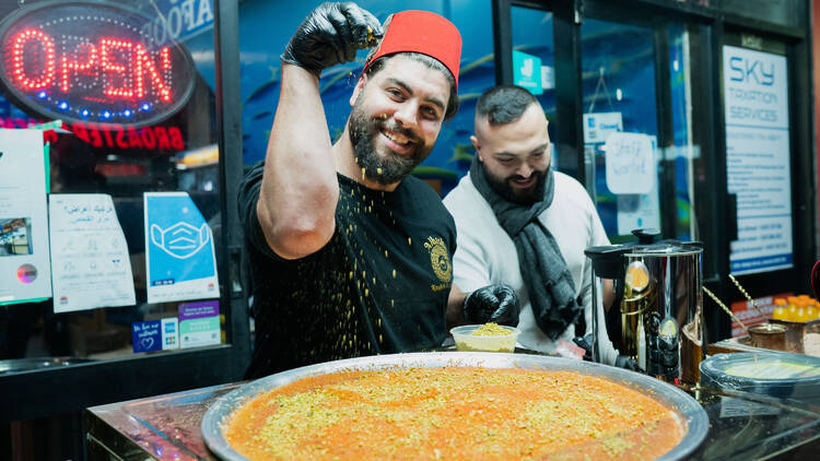 A cook preparing a vibrant dish at Ramadan Nights Lakemba