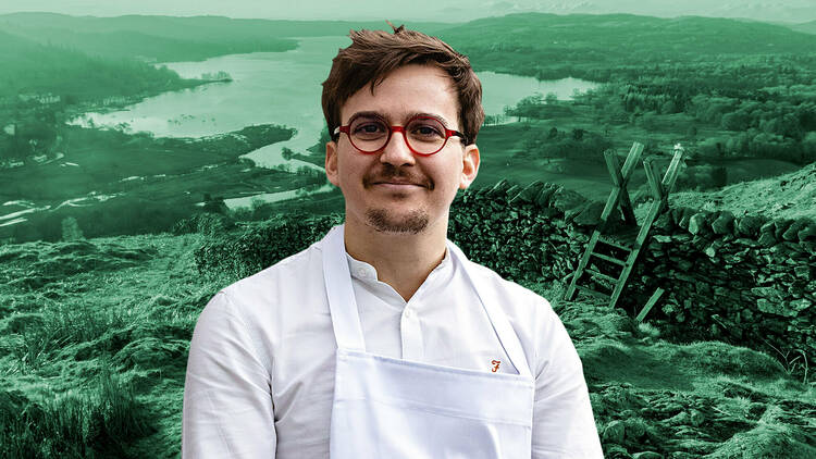 A chef in front of the lake district landscape 