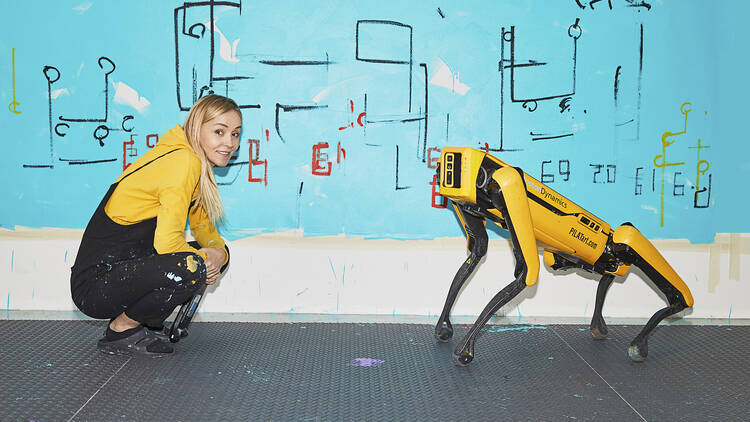 picture of Agnieszka Pilat with robot dog