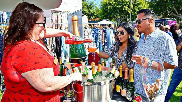 LAWineFest LA Wine Fest a couple receives a pour of orange wine 