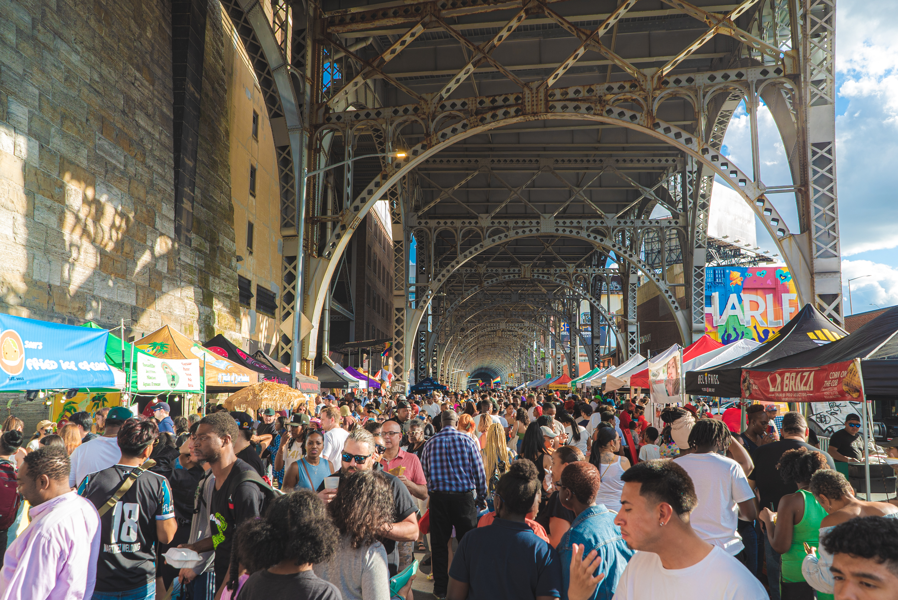 People pack into the Uptown Food Market.