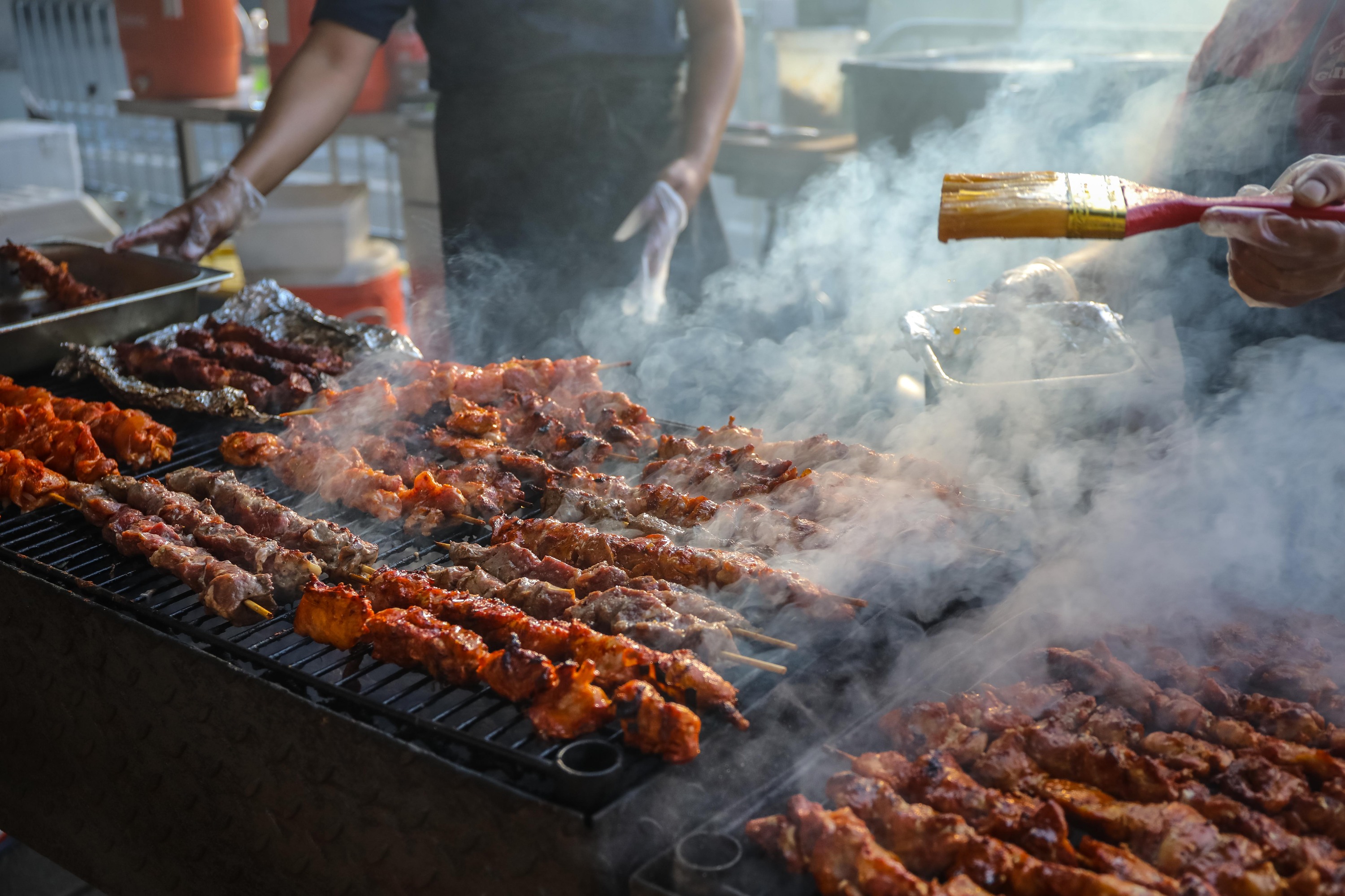 Meats being cooked at the Uptown Night Market.