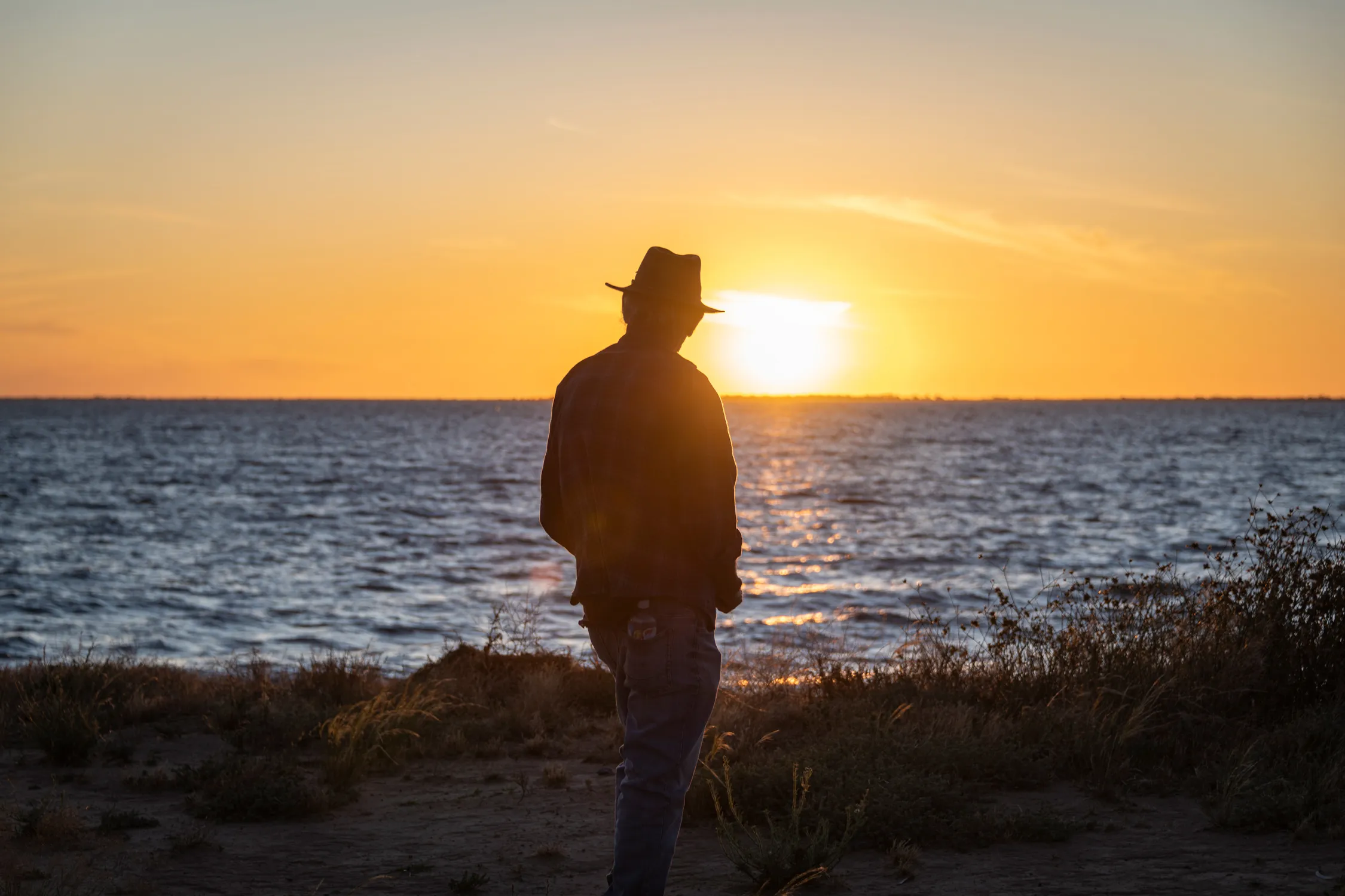 Uncle Badger Bates looking out at a sunset
