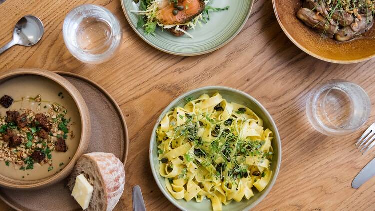 A plate of pasta on wooden table