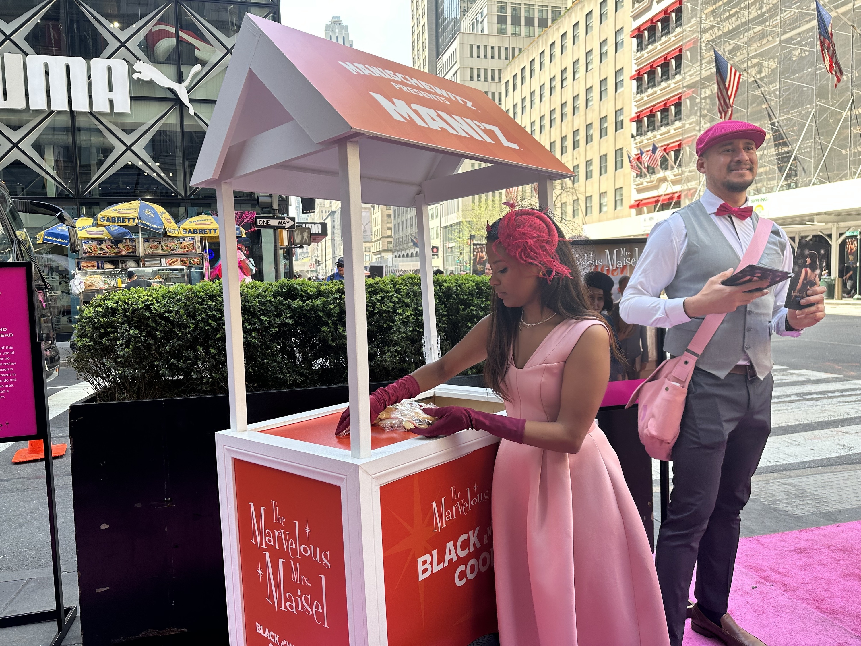 Staff hand out black-and-white cookies.