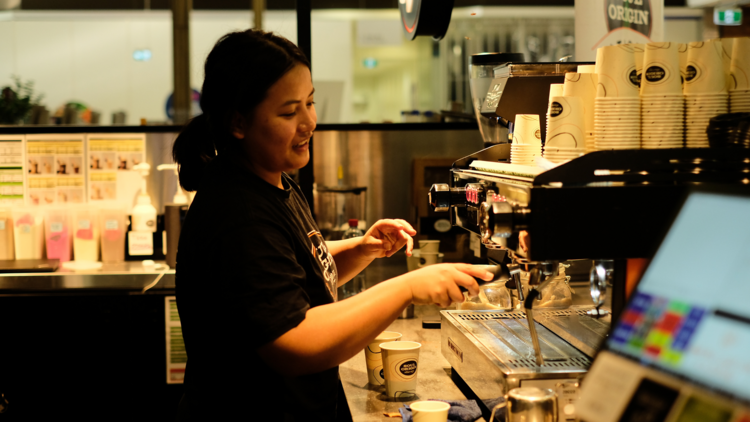 A barista making coffee