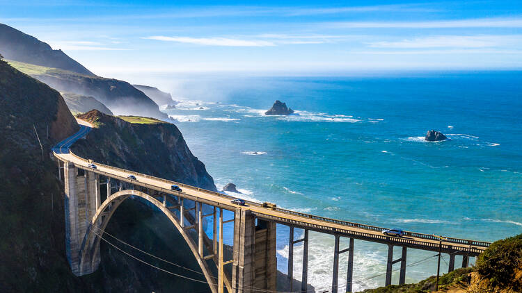 Aerial Bixby Bridge (Rocky Creek Bridge) and Pacific Coast Highway near Big Sur in California, USA America. Drone Shot