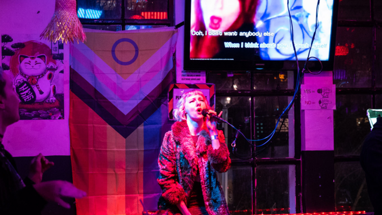 picture of woman singing karaoke