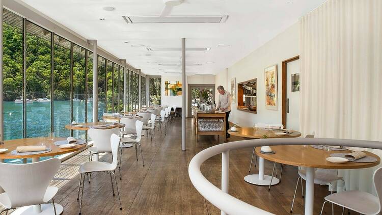The interior of Berowra Waters Inn with the Hawkesbury River outside