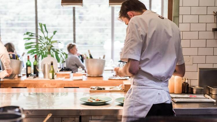 The kitchen of Berowra Waters Inn with the Hawkesbury River outside