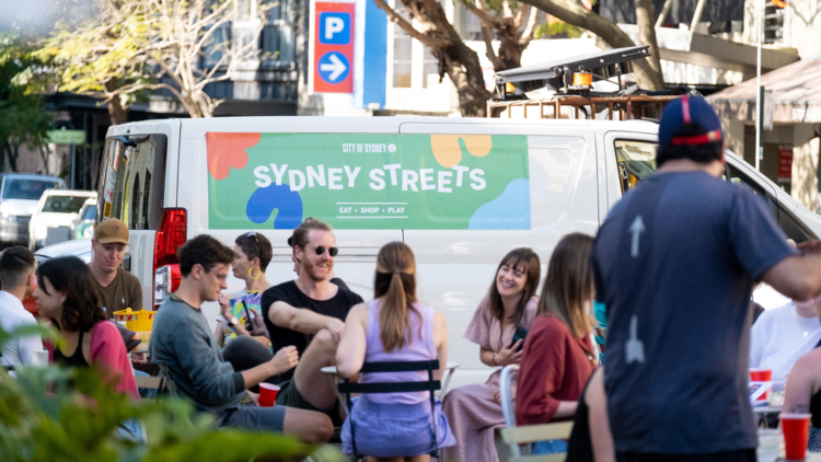 A Sydney Streets van with people alfresco dining