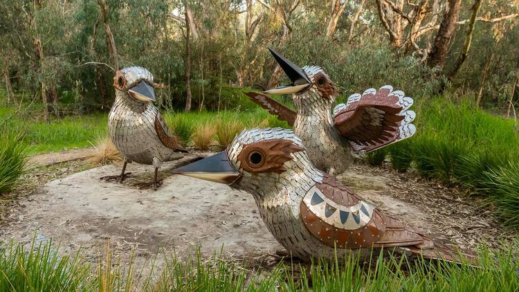 A sculpture of three kookaburras