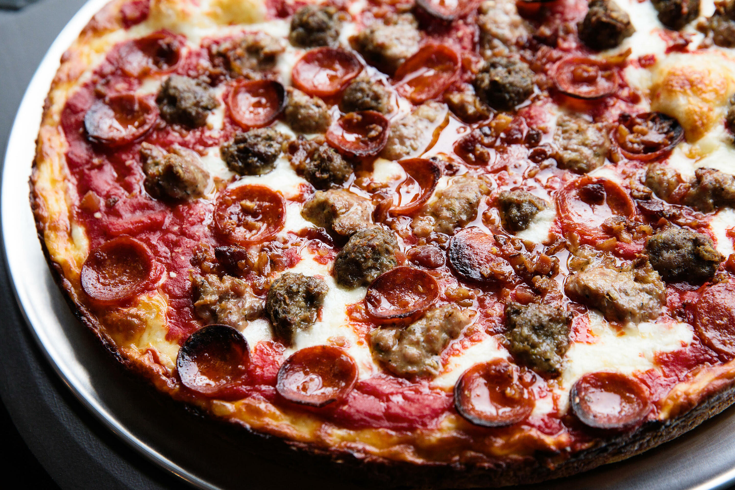 Loaded Deep Dish Pizza with Sausage & Peppers