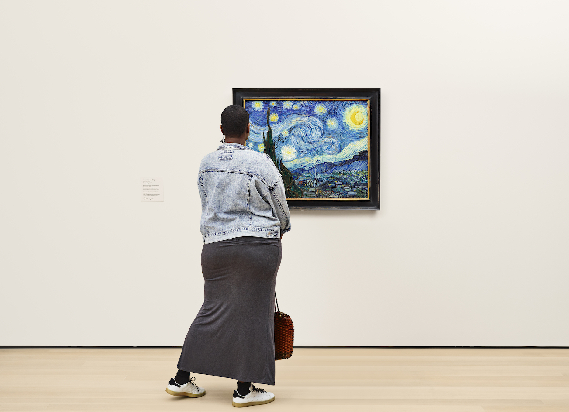 A woman admires Van Gogh's "Starry Night." 