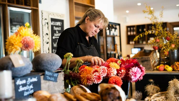 A shopkeeper and florist in her shop