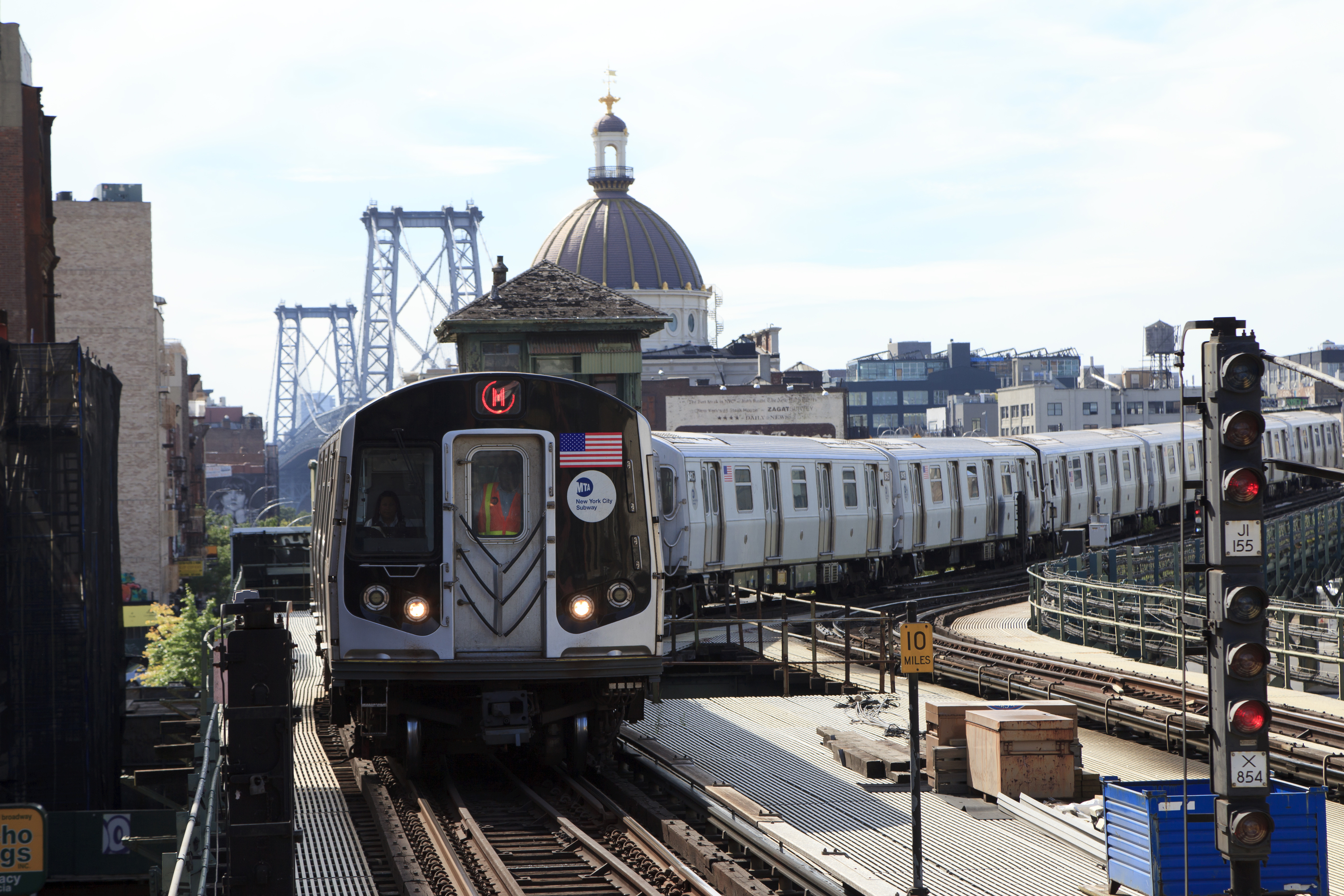 A Flushing line subway train in Times Square is wrapped in