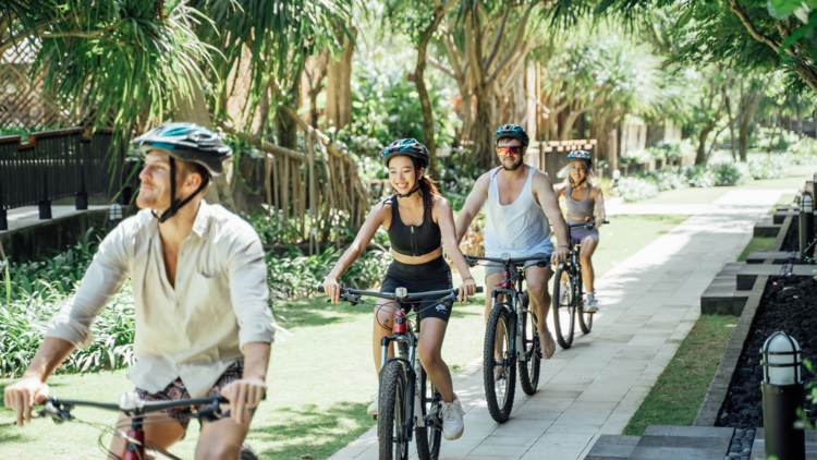 People bike riding in Bali