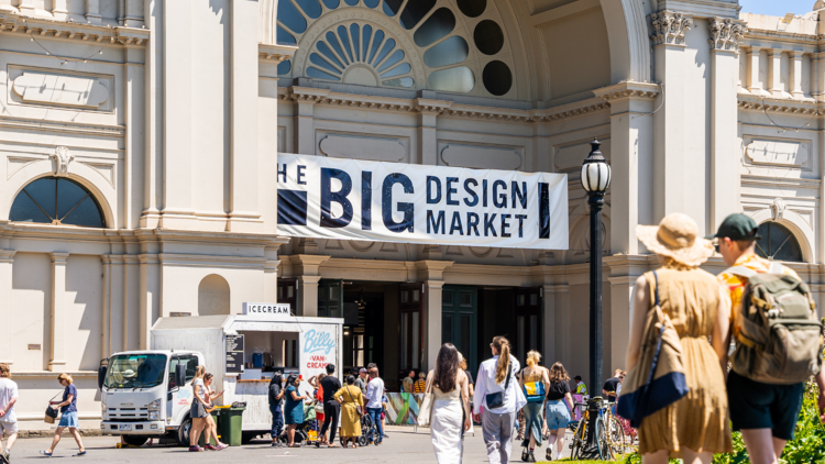 The exterior of the Royal Exhibition Building with a food truck and a sign that says 'The Big Design Market'.