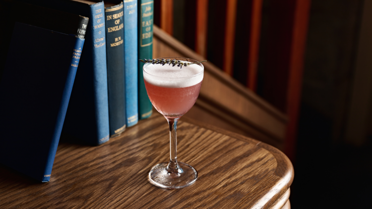 Frank Mac's cocktail on a bookshelf