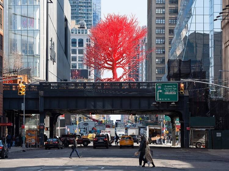 A giant red tree sculpture is growing out of the High Line right now