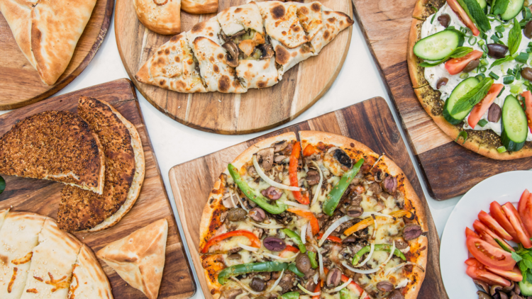 A spread of Lebanese pizzas