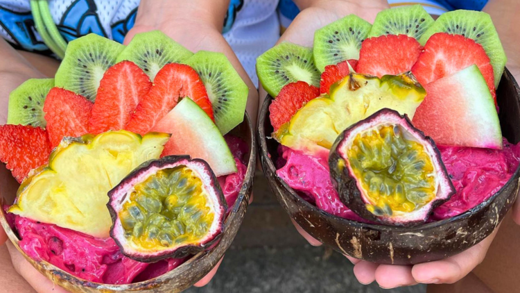 Two smoothie bowls with fresh fruit