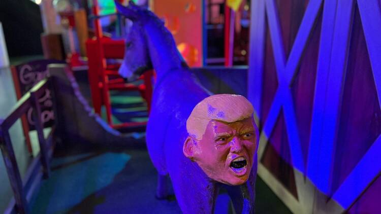 Donald Trump's face on a donkey's bottom