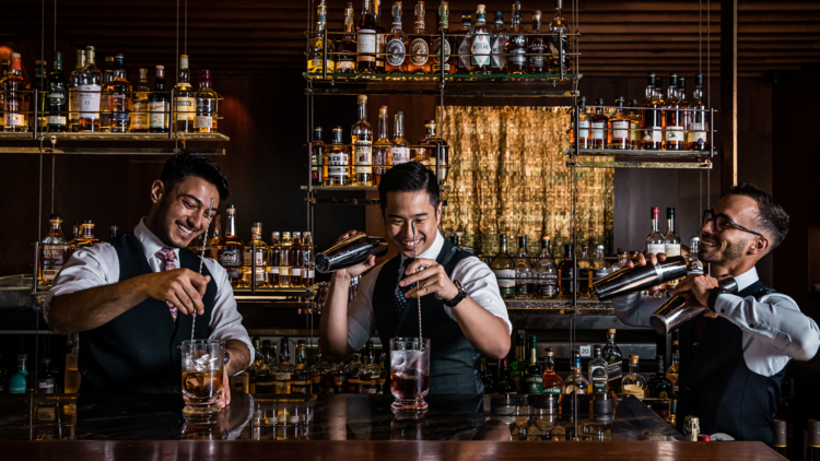 Grain Bar's bartenders mixing cocktails