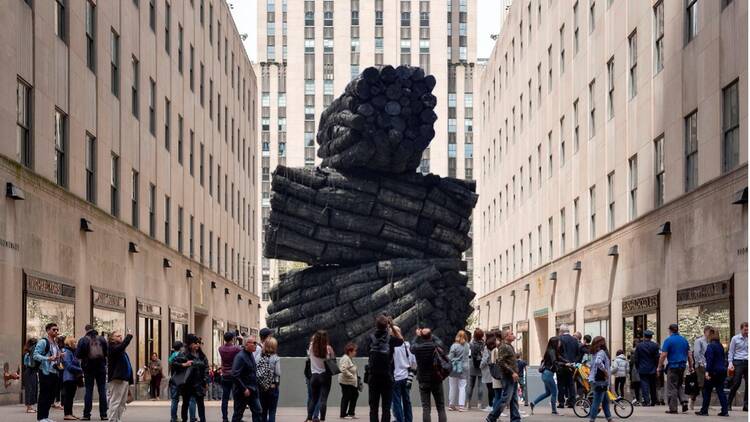 Lee Bae's stacked charcoal sculpture at Rockefeller Center