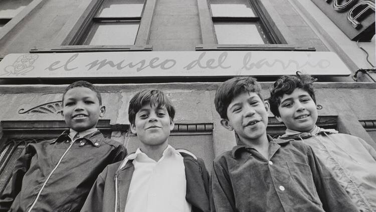 Four children outside of El Museo del Barrio, P.S. 206, 508 East 120th Street, New York City.
