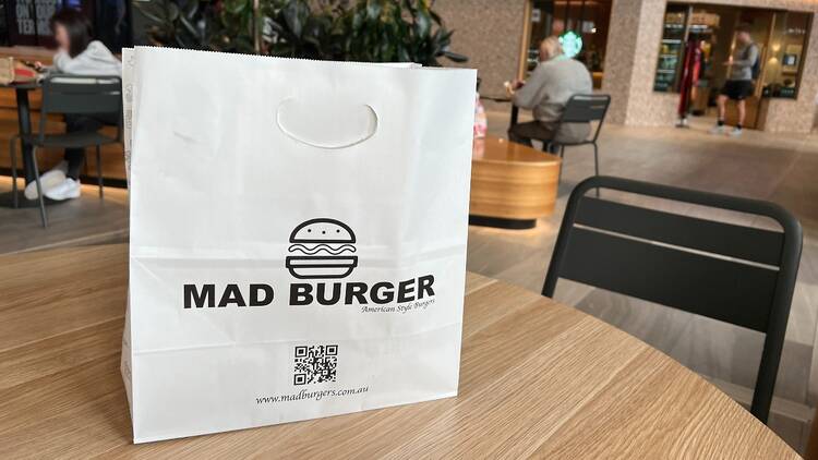 A Mad Burger takeaway bag