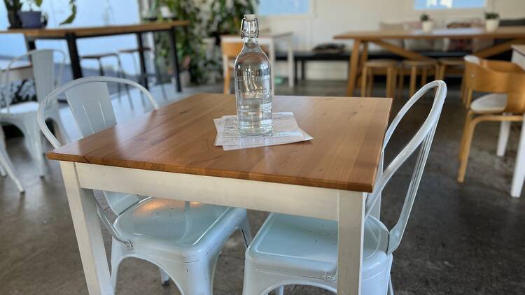 A bottle of water on a cafe table