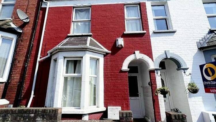 A red painted terraced house 