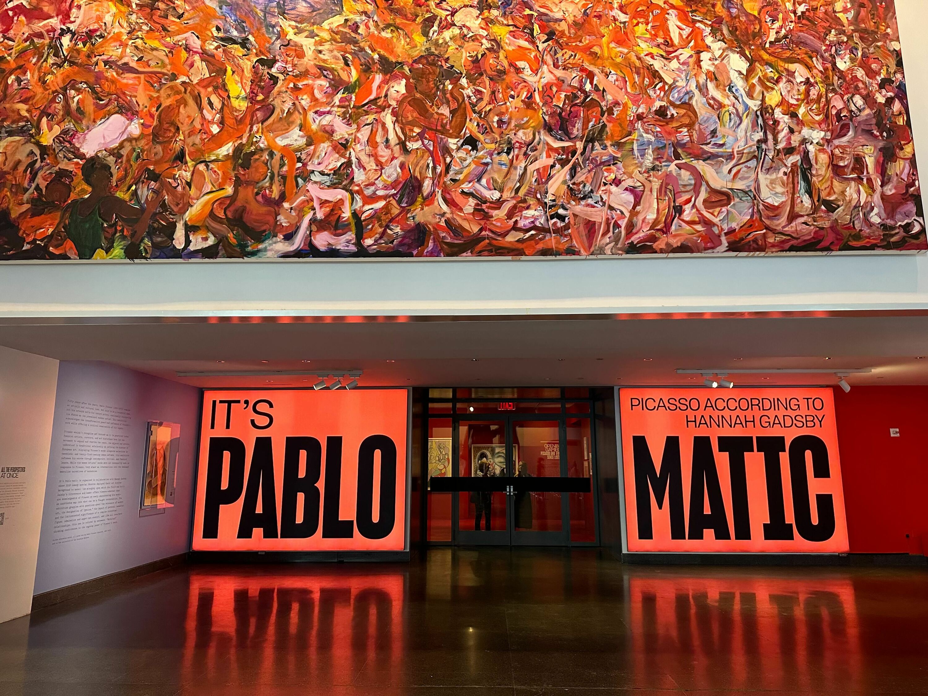 A red wall sign for It's Pablo-matic.