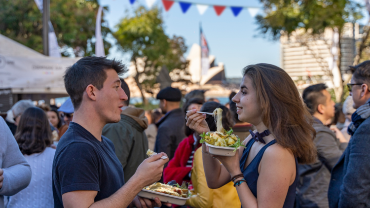 To people eating at Bastile Festival