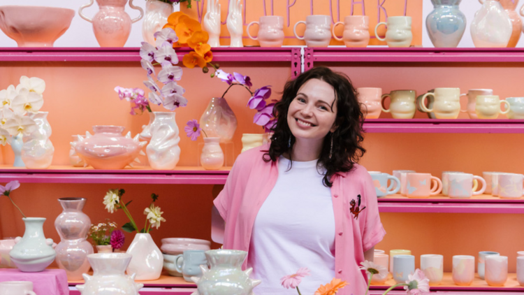 Girl in front of colourful display 