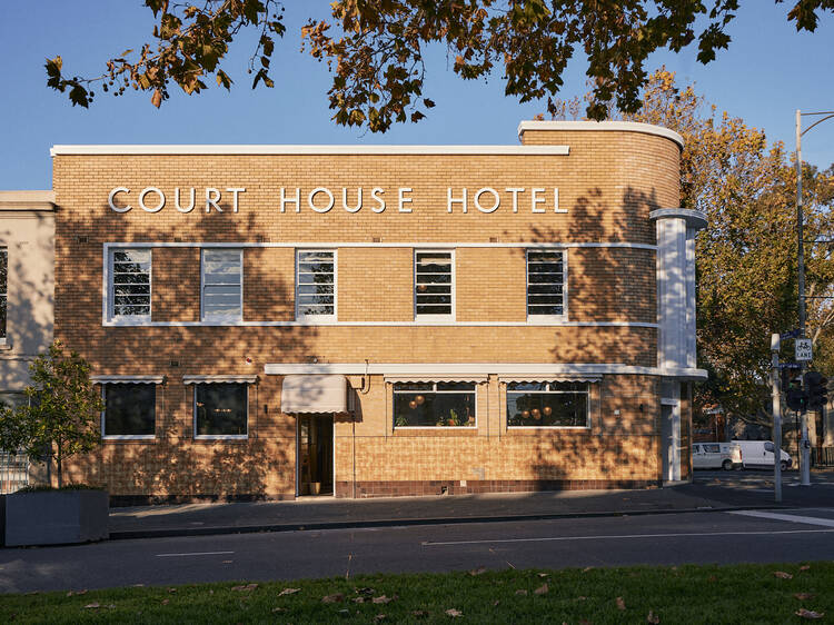 The Courthouse Hotel street view with blue sky in the background.