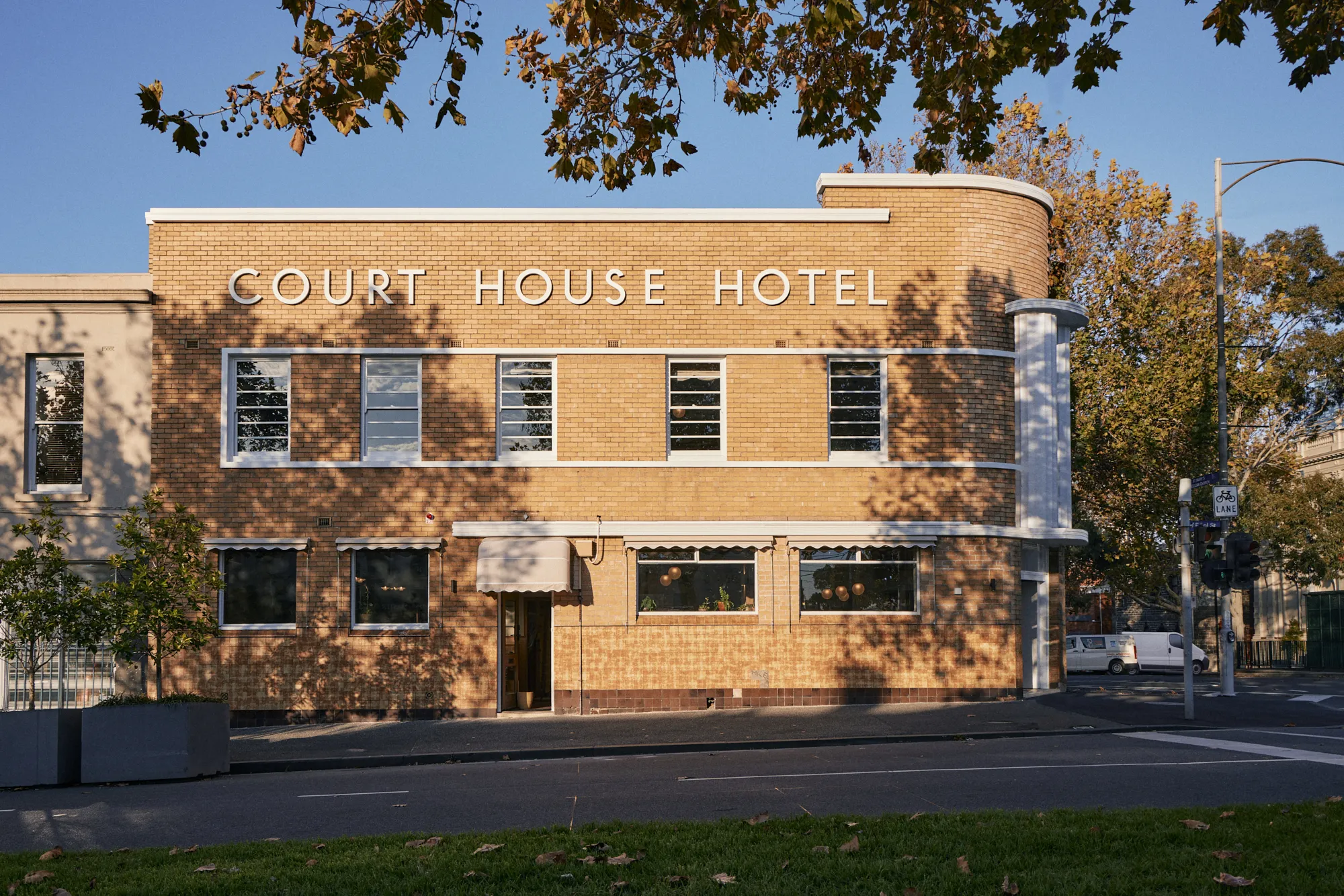 The Courthouse Hotel street view with blue sky in the background.